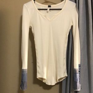 We the free thermal with detailed sleeves